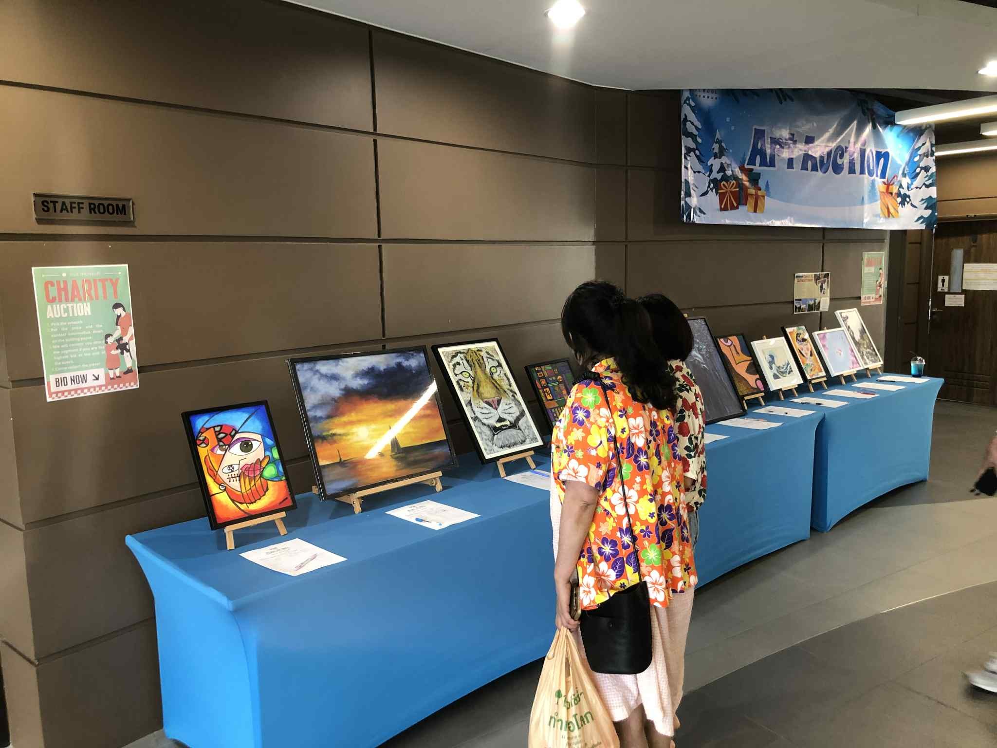 Student art displayed at a charity auction event